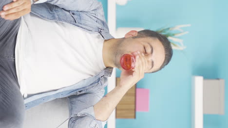 Vertical-video-of-The-man-is-drinking-water.